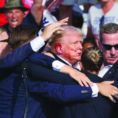 Bloodied Trump 'safe' after shots fired at rally
